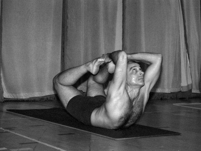 A bound reclining posture, photographed in black and white.