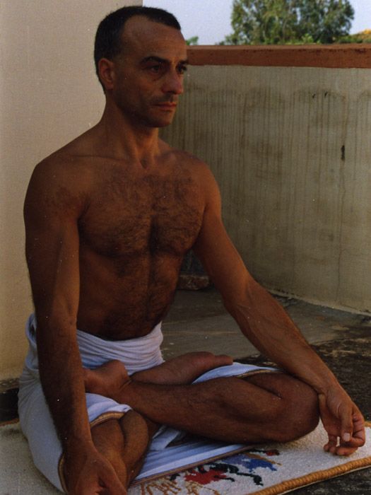 Seated in lotus on a terrace in South India.