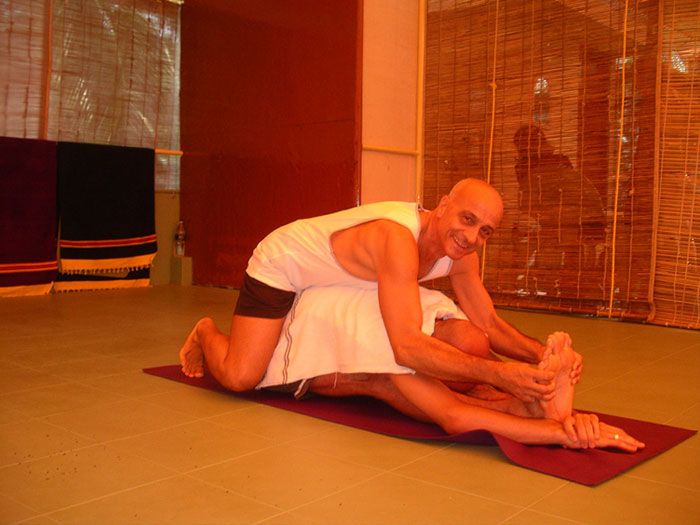 An adjustment given on the mat during a class in Kovalam.